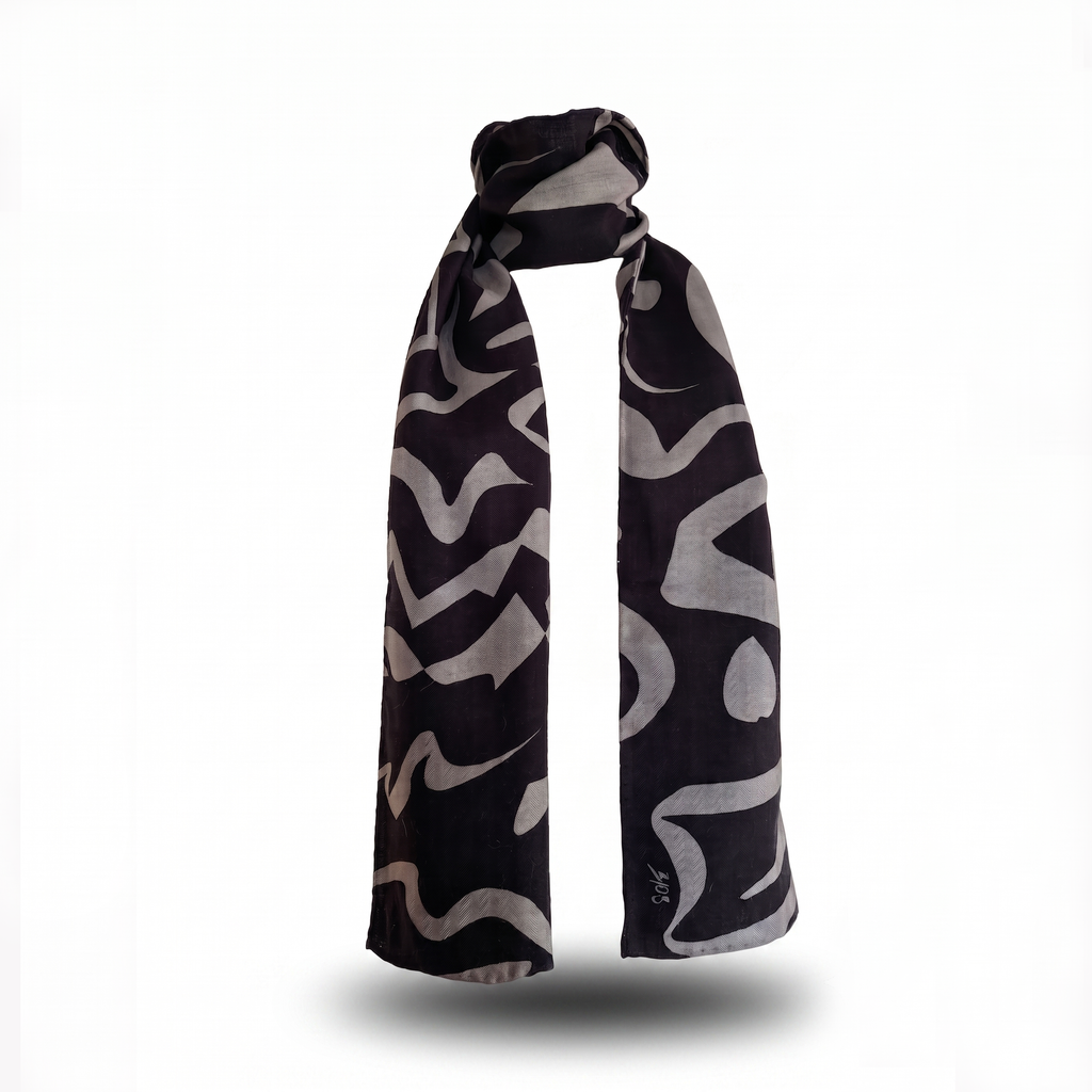 Premium long silk wool blend scarf, measuring 30x180cm, in the "Tectonic Monochrome" design, featuring a bold abstract graphic pattern of dark grey and deep black shapes, styled in an upright wrap format against a clean white background.