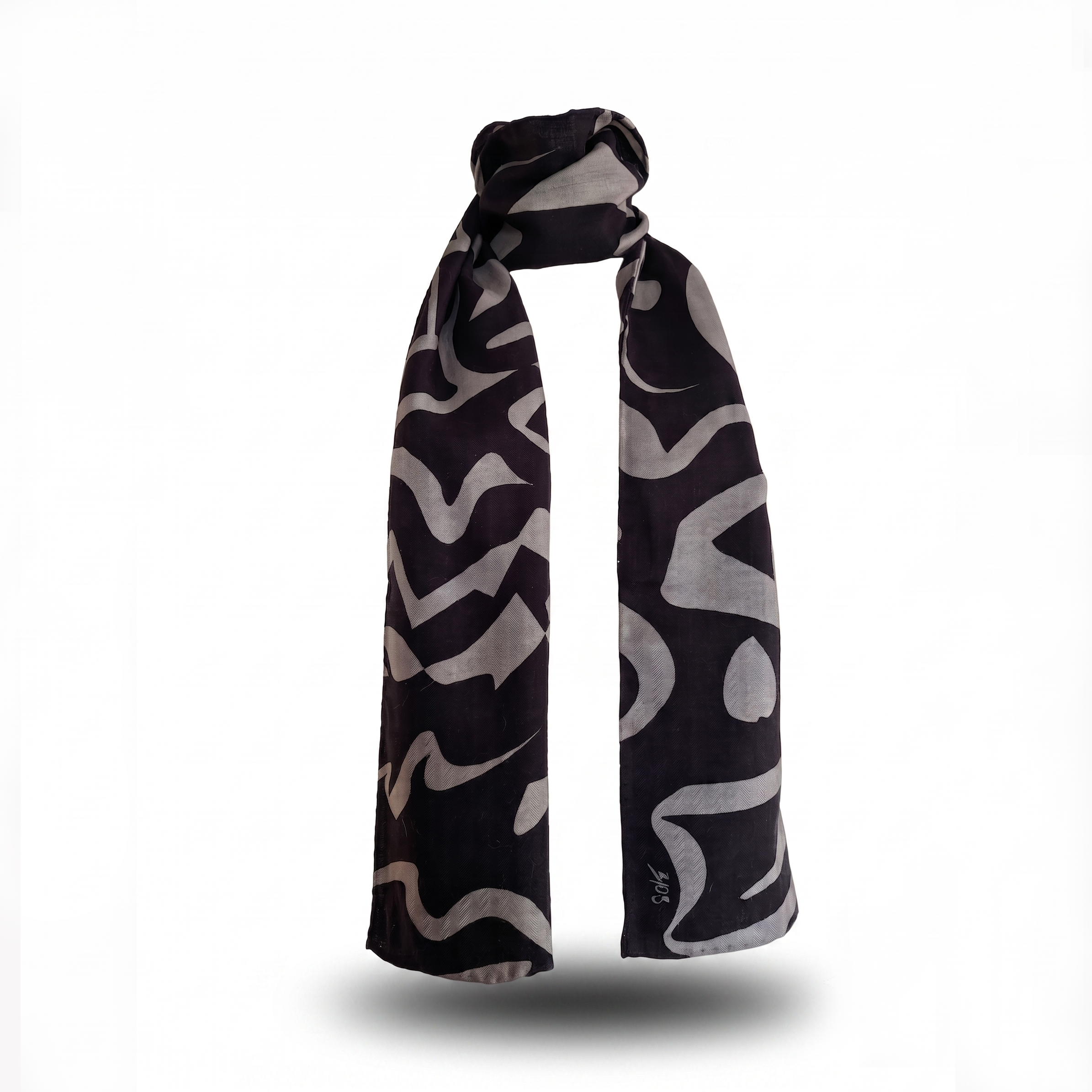 Premium long silk wool blend scarf, measuring 30x180cm, in the "Tectonic Monochrome" design, featuring a bold abstract graphic pattern of dark grey and deep black shapes, styled in an upright wrap format against a clean white background.