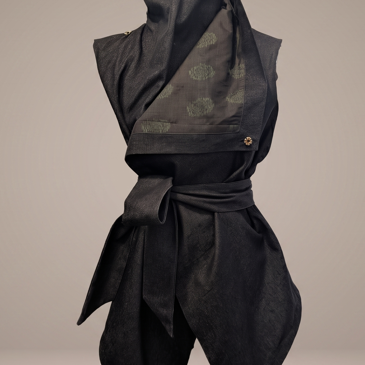 Close-up front view of the B108 Denim Kimono Vest showing the folded lapel, brass button, and upcycled green vintage Japanese kimono silk lining.