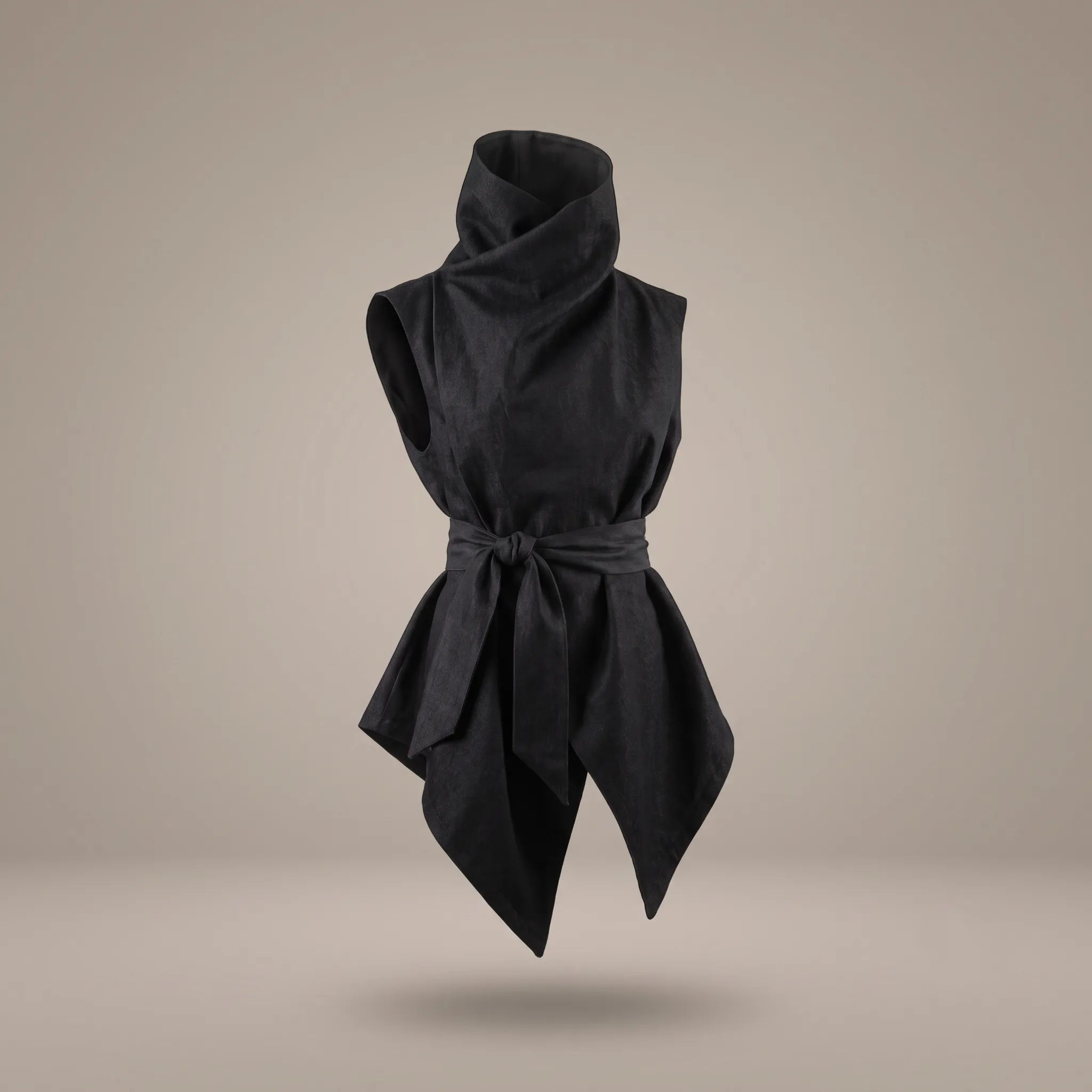 Front view of the Black Denim Kimono Vest floating on a warm grey background, featuring a high sculptural cowl collar, wrapped tied waist sash, and asymmetrical angular hem by B108 DESIGN.