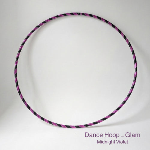 Dance hula hoop ON SALE – Midnight Violet Glam Edition. Professional black tubing featuring a reflective purple mirror and grip tape spiral design for dance and fitness.