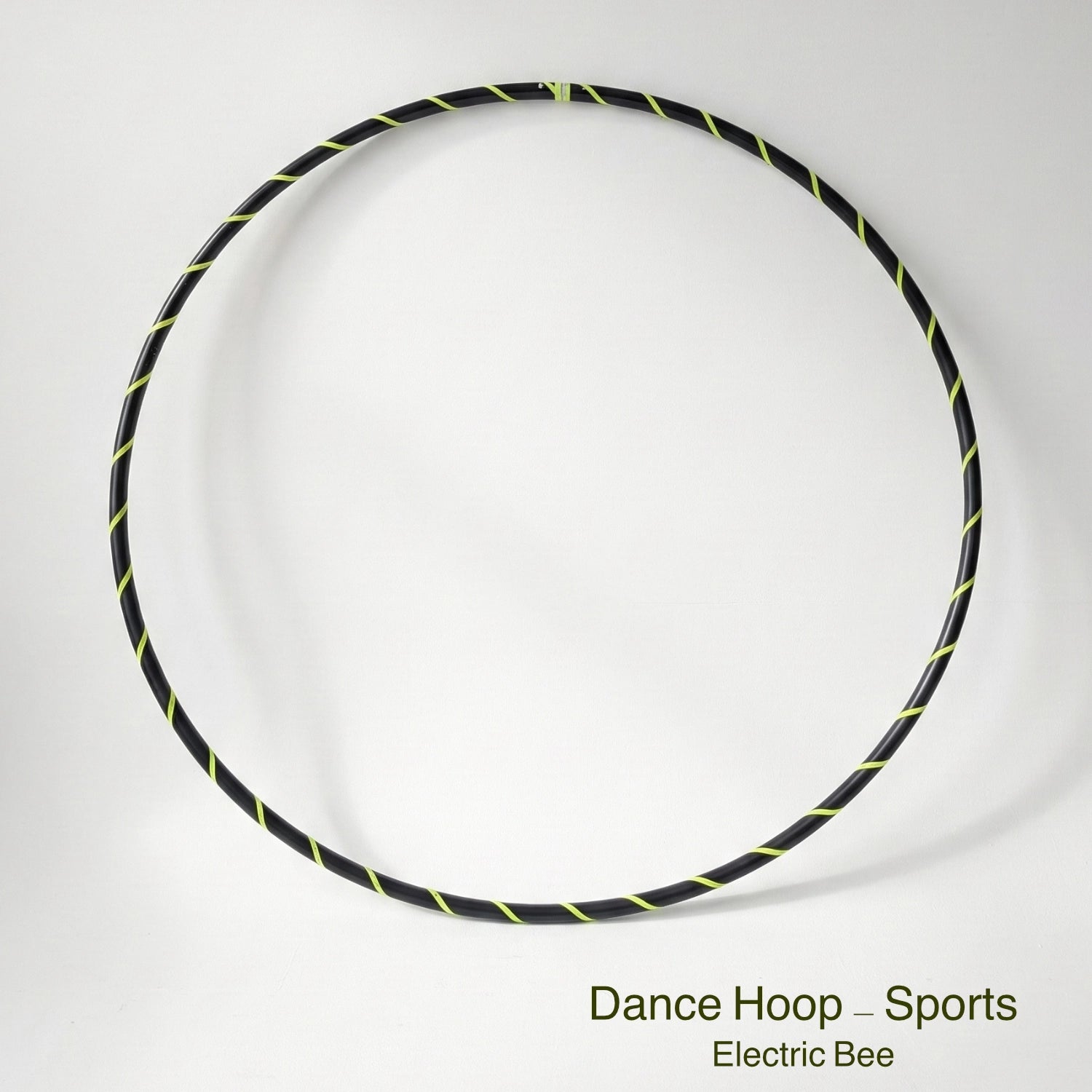 Dance hula hoop – Electric Bee Sports Edition. Professional black tubing featuring a UV-sensitive fluoro yellow spiral tape design.