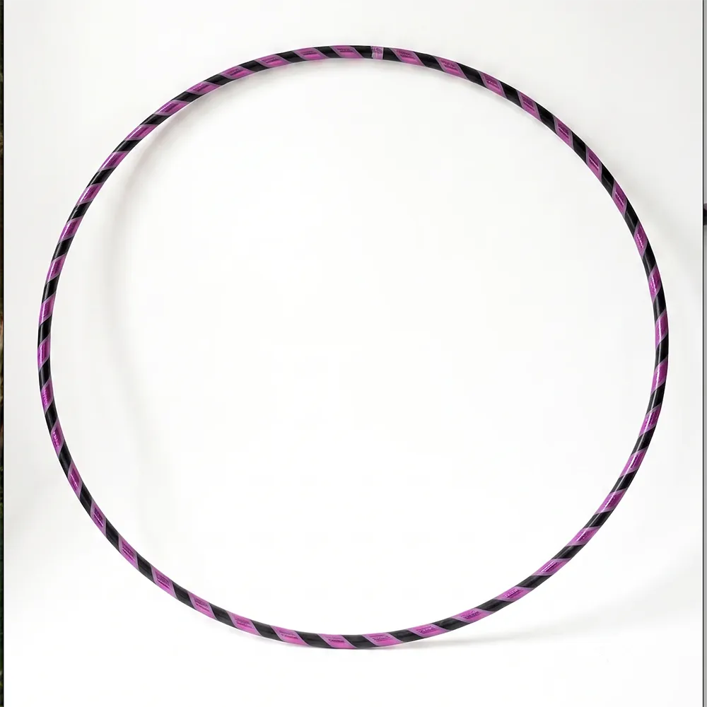 Studio shot of the B108 DESIGN Archive Glam Dance Hula Hoop with a purple and black spiral grip tape design set against a plain white background.