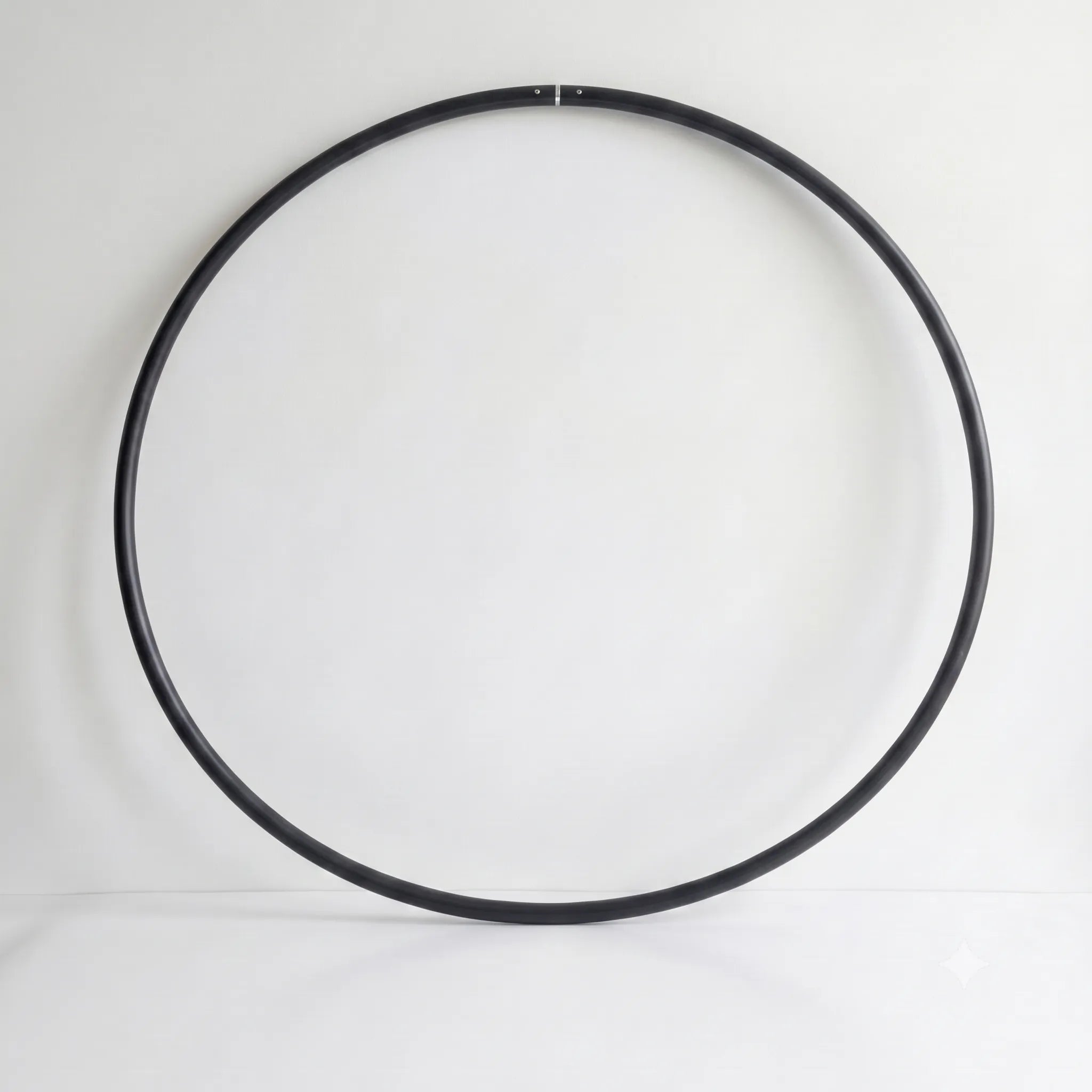 Recycled Polymer Dance Hoop in Obsidian Black on a white backdrop - B108 DESIGN