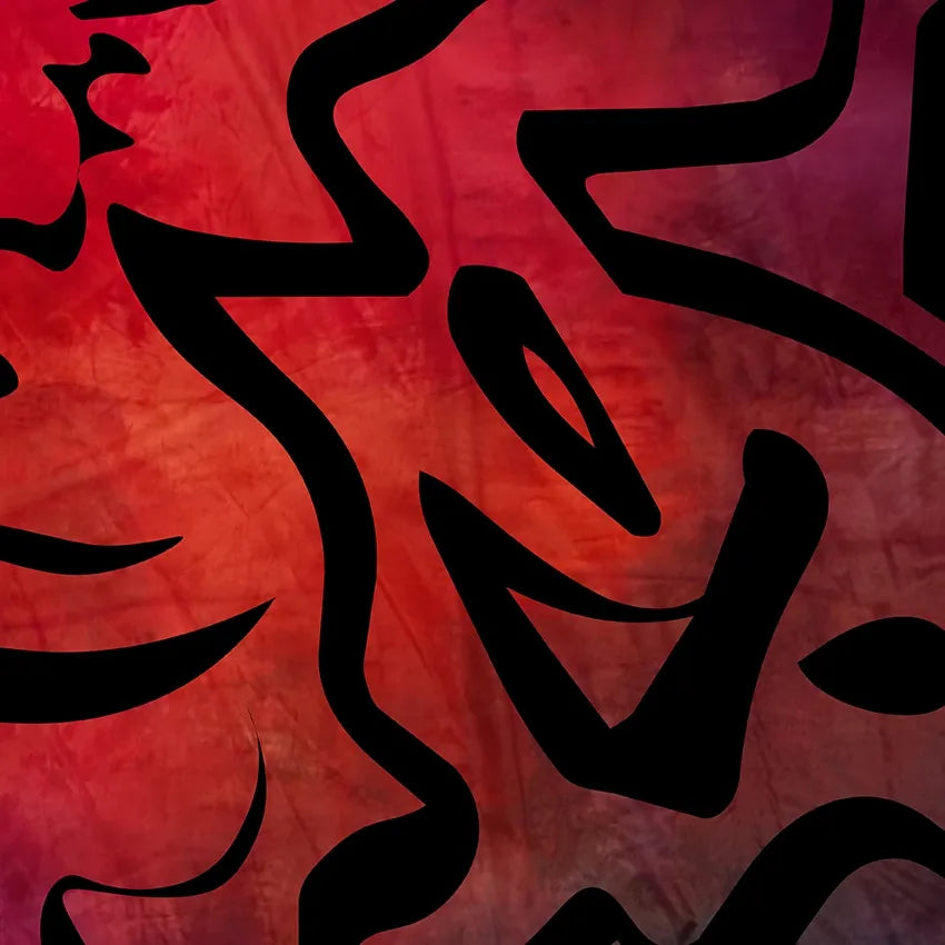 Close-up fabric swatch detail of the Tectonic Ember design by B108 Design, showcasing bold black calligraphic linework printed over a textured red and crimson background.